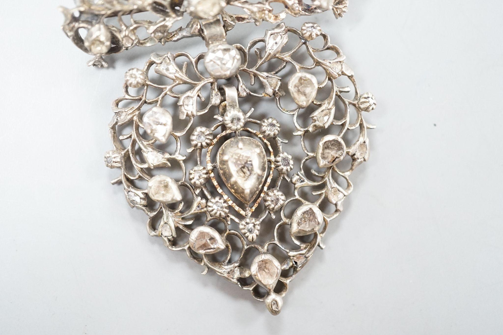 A 19th century white metal and rose cut diamond set heart shaped drop pendant brooch, 50mm.